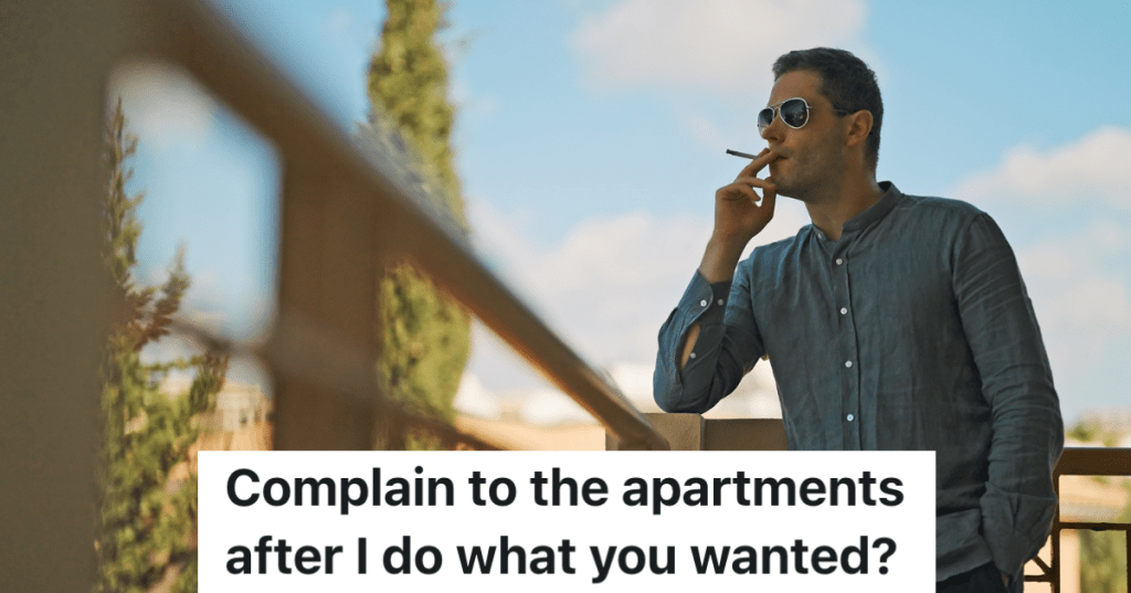 man smoking cigarette outside on balcony