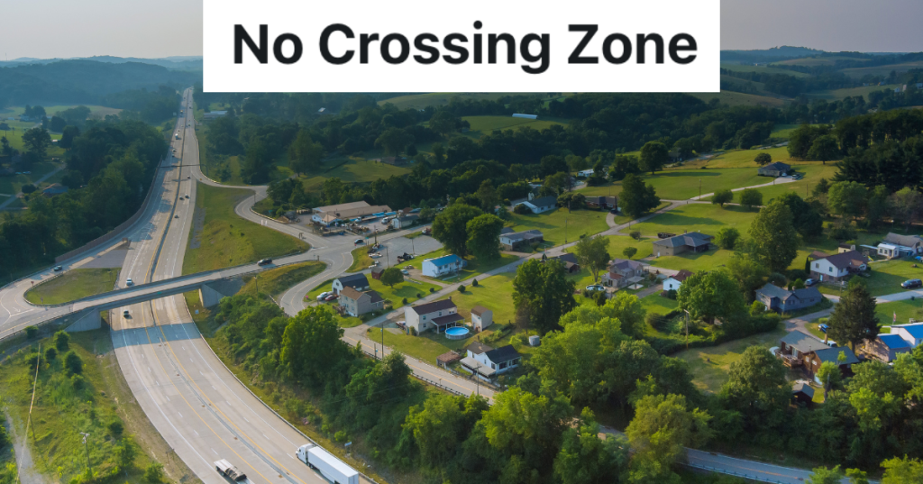 aerial shot of highway and neighborhood