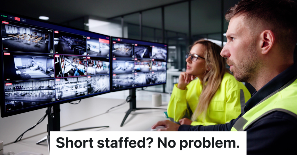 two people working in a control room watching monitors
