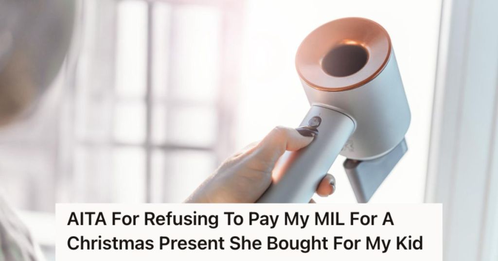 Woman holding a Dyson airwrap hari dryer