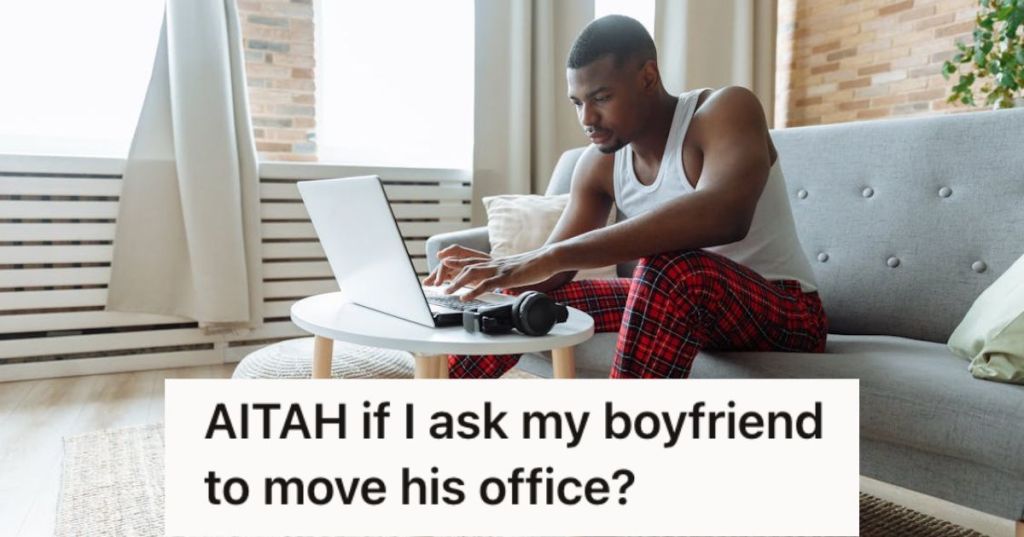 Man working in the living room with his laptop