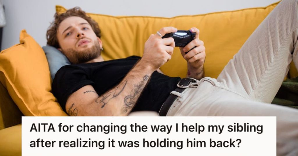 Man lying on the couch playing video games