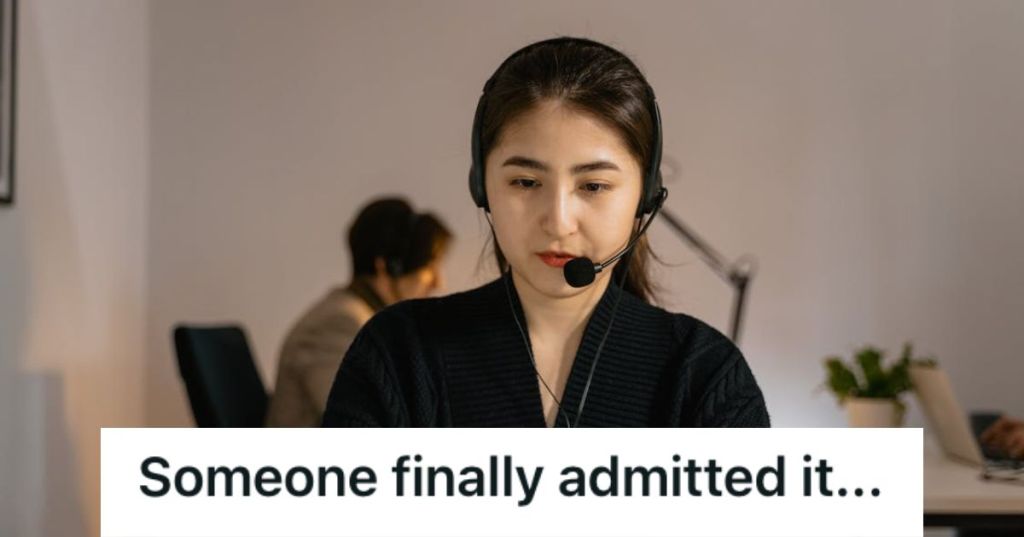 Call center worker wearing a headset and a serious face
