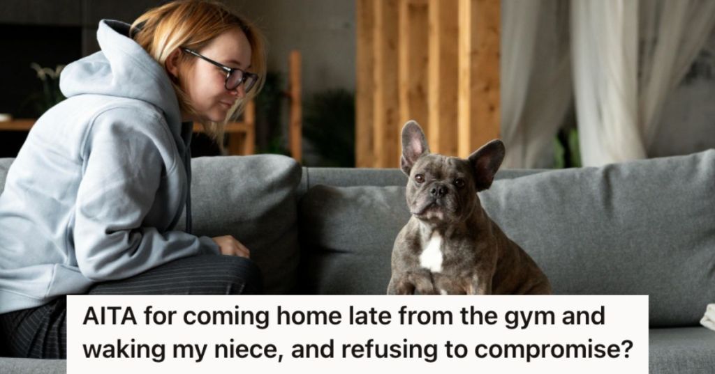 Woman looking at her dog sitting on the couch