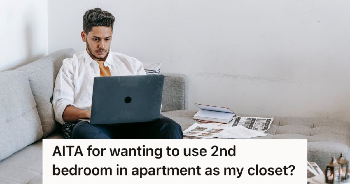 Man sitting on the couch and working on his laptop