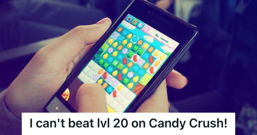 Person playing Candy Crush on mobile phone