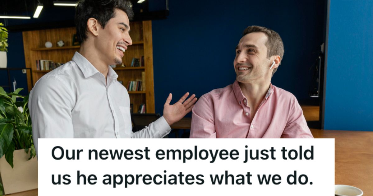 Two male employees talking and smiling at each other