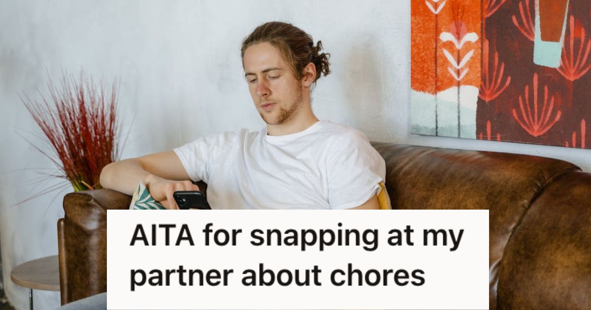 Man sitting on the couch and tinkering on his phone