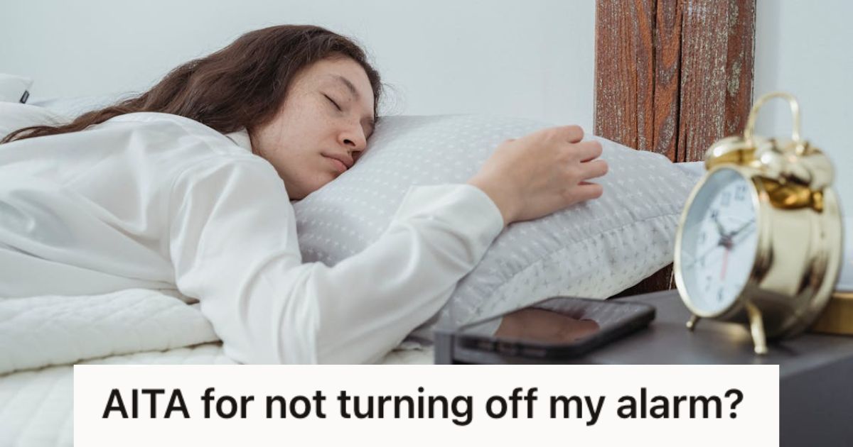 Woman sleeping on the bed with her phone and clock on the side table