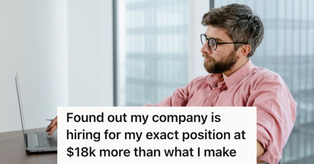 Man working in an officee with his laptop