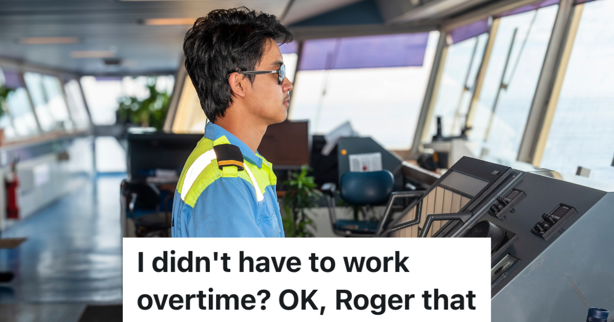 Male deck officer standing on the bridge of a ship