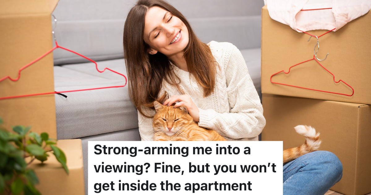 woman sitting between moving boxes holding orange cat