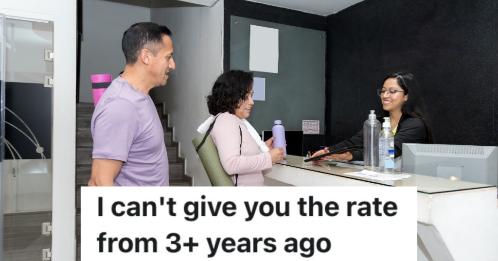 older couple talking to front desk employee at a gym