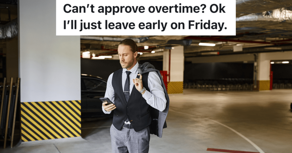 businessman looking at his phone in a parking garage