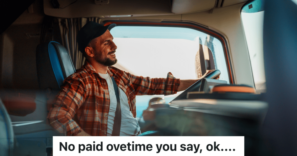smiling truck driver behind the steering wheel