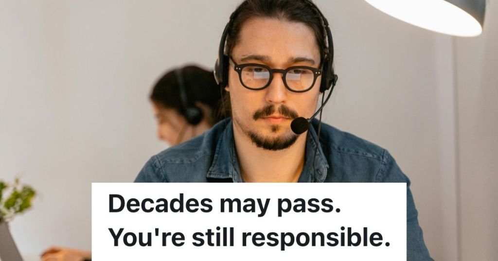 Man wearing headset looking at computer