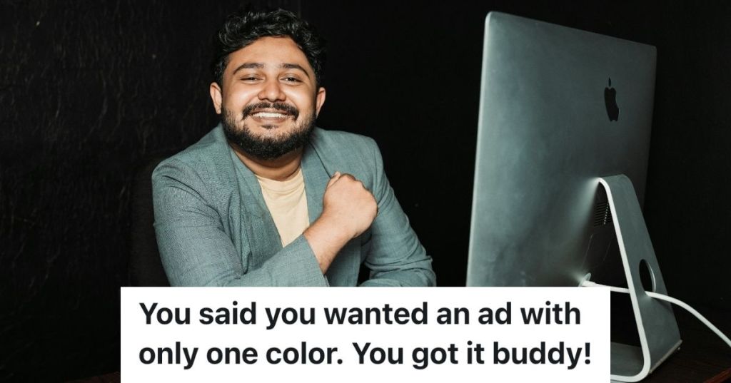Man smiling while at computer