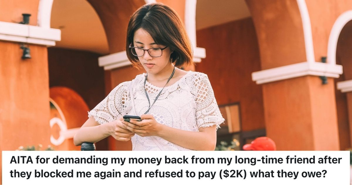 Young woman typing on a smartphone