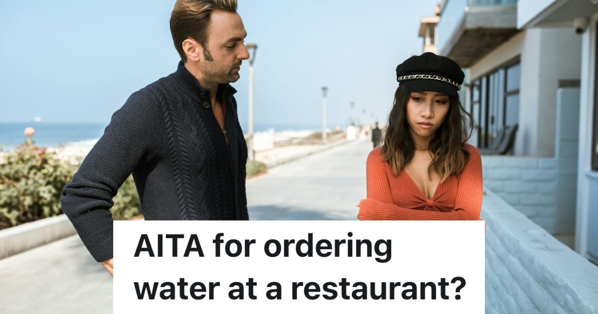 A man lecturing a woman by a beach