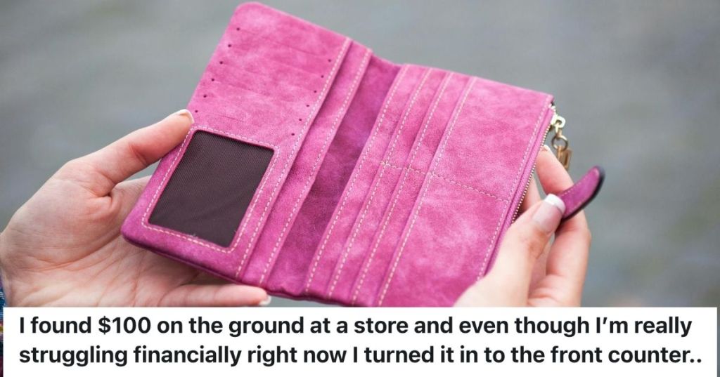 Woman's hand holding an empty wallet