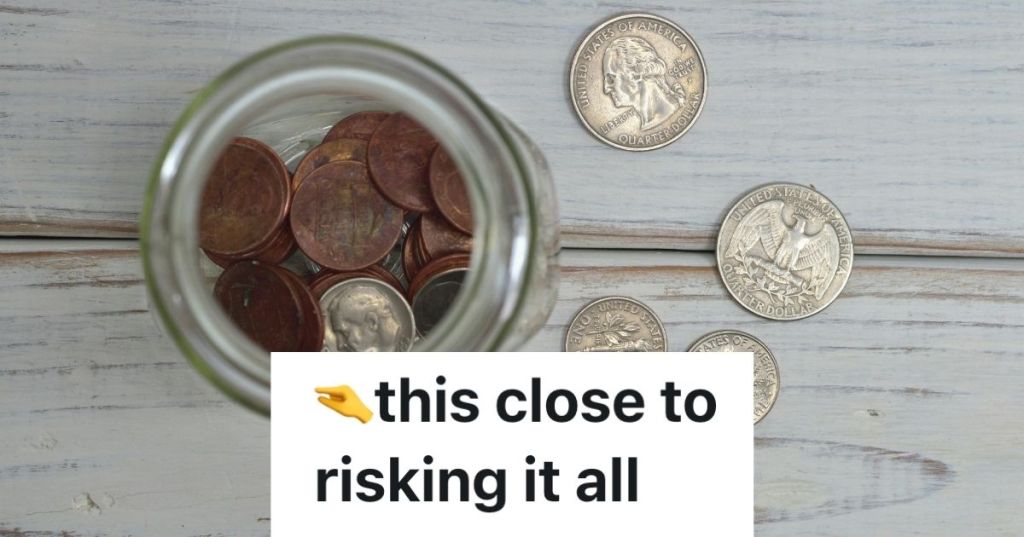 Loose change on a table beside a jar of change