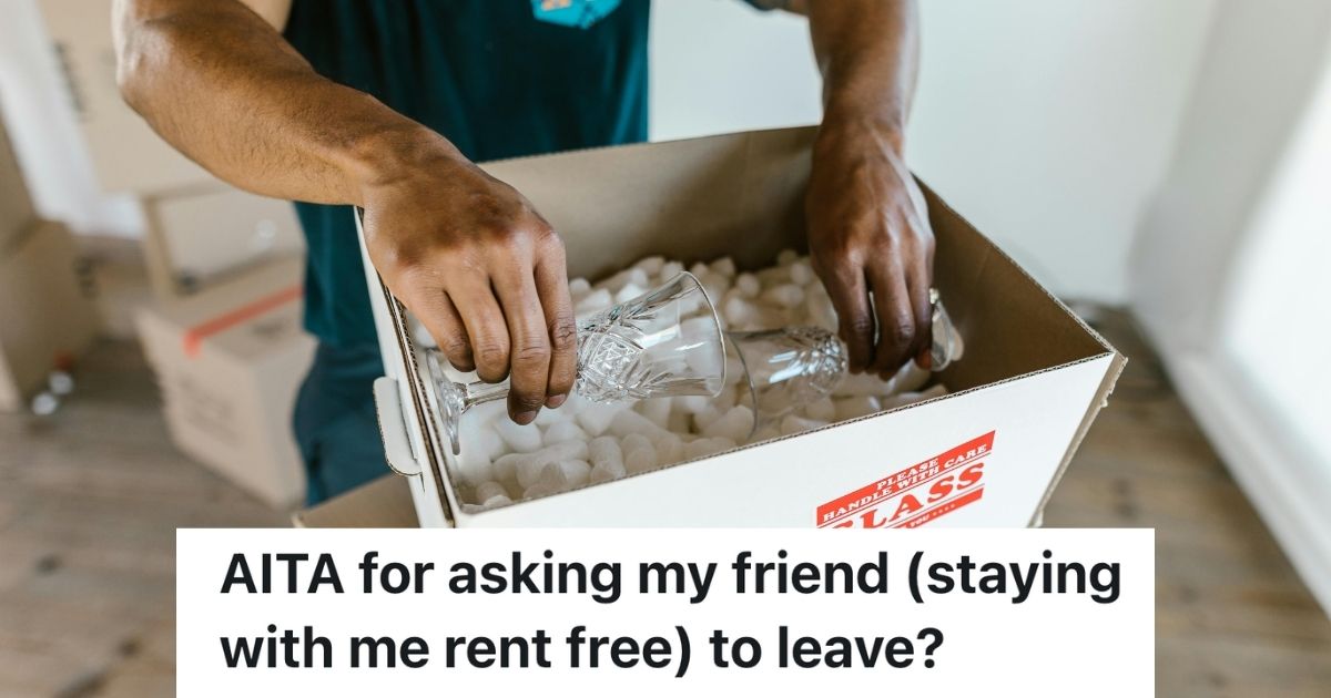 Man packing a box marked "Glass"