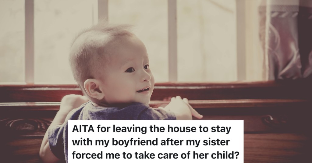 toddler boy standing up on wall and smiling