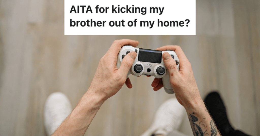 Overhead of hands holding game controller.