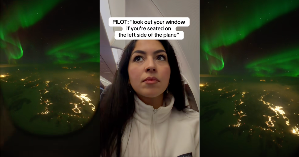 woman looking at the northern lights