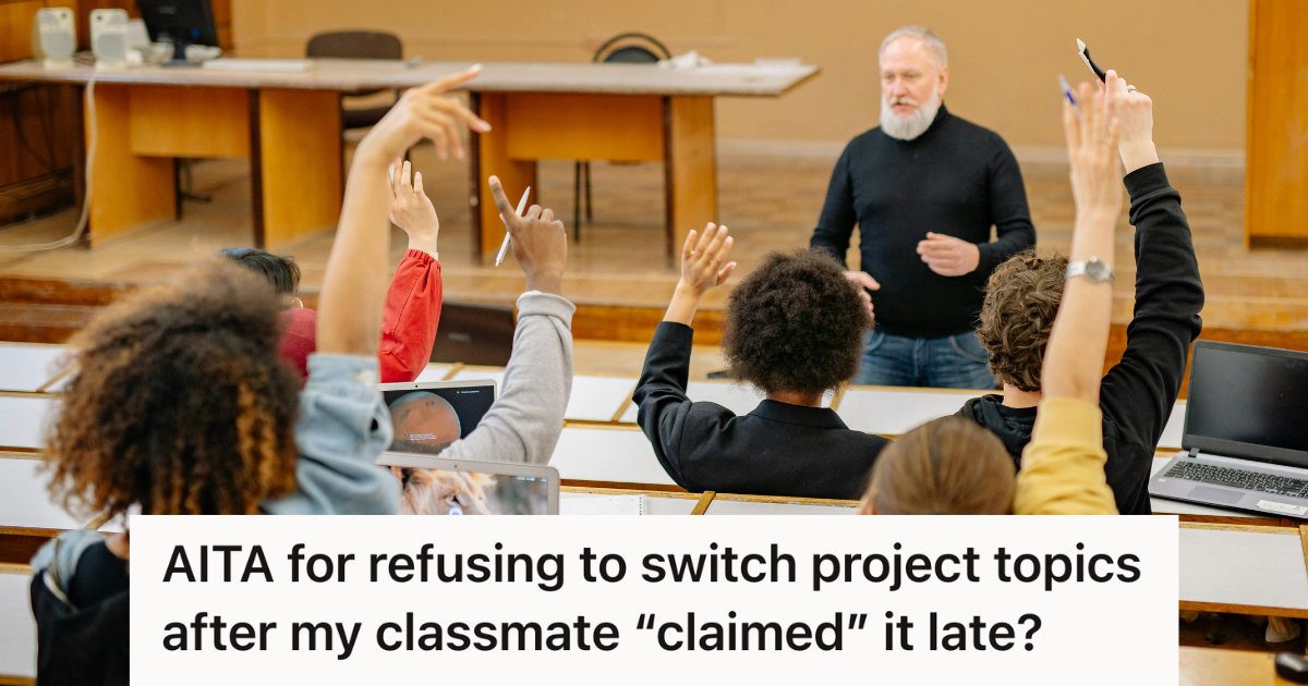 college students raising hands during a lecture