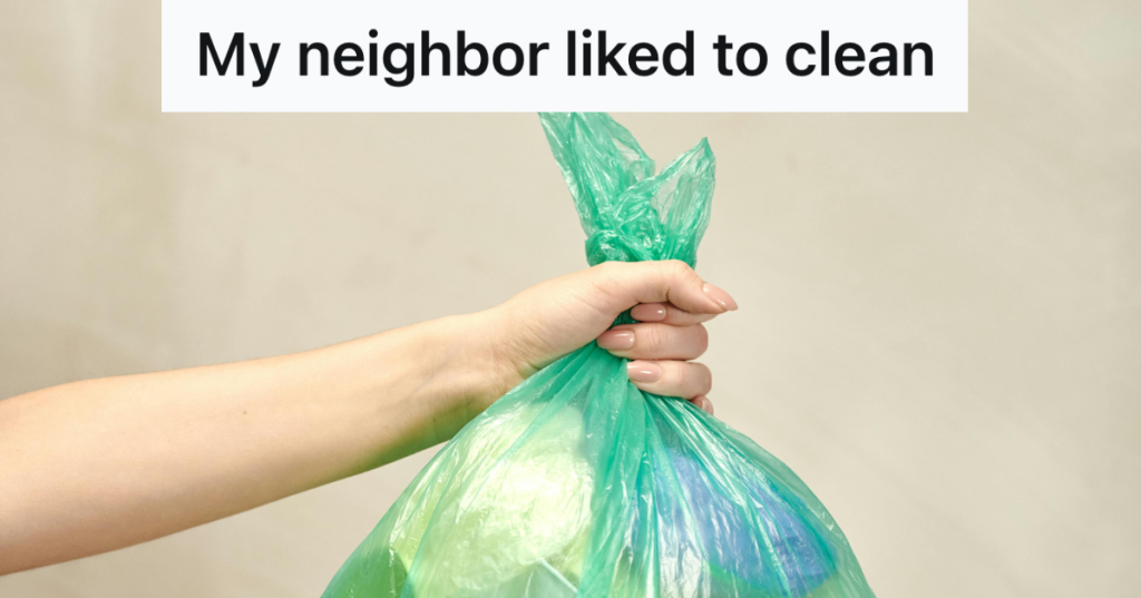 holding green garbage bag