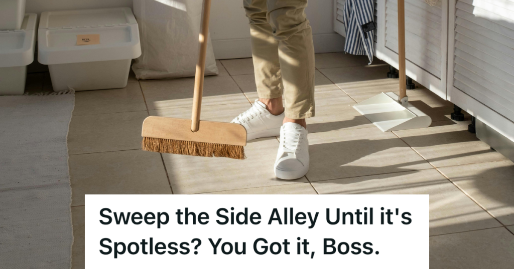 man holding a broom