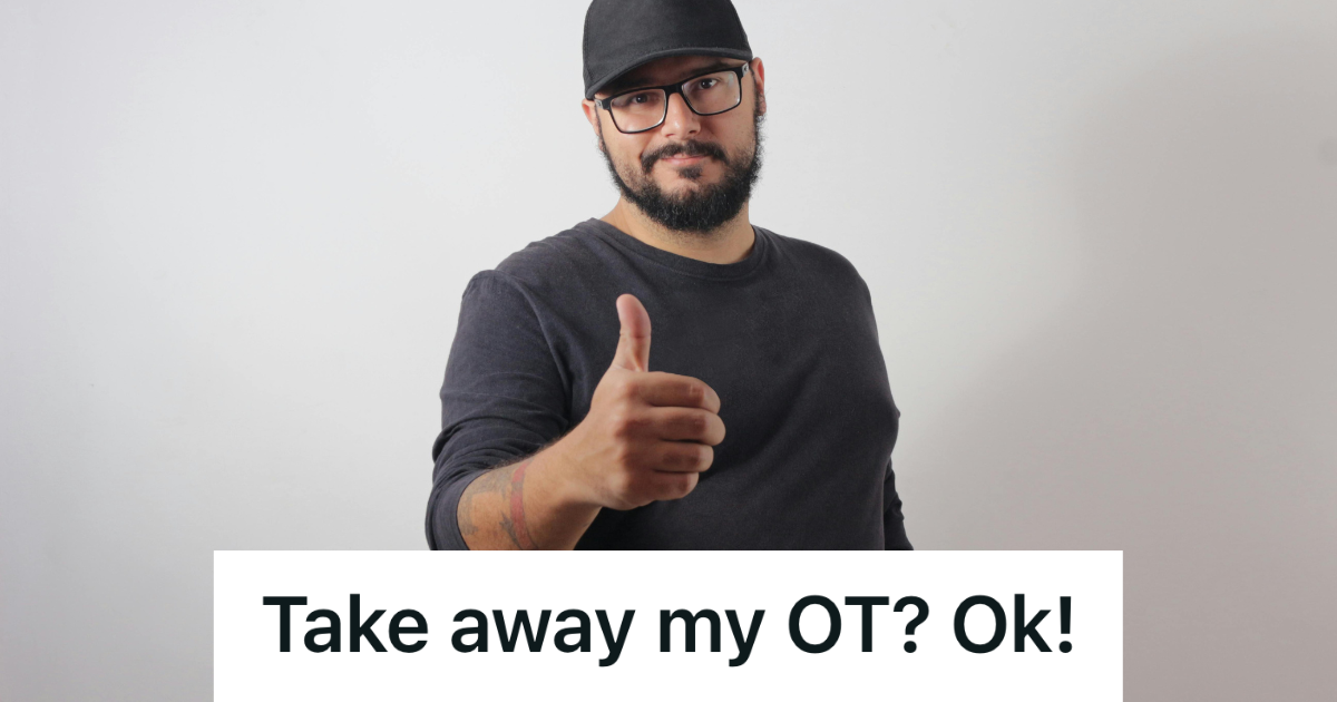 man in all black giving thumbs up