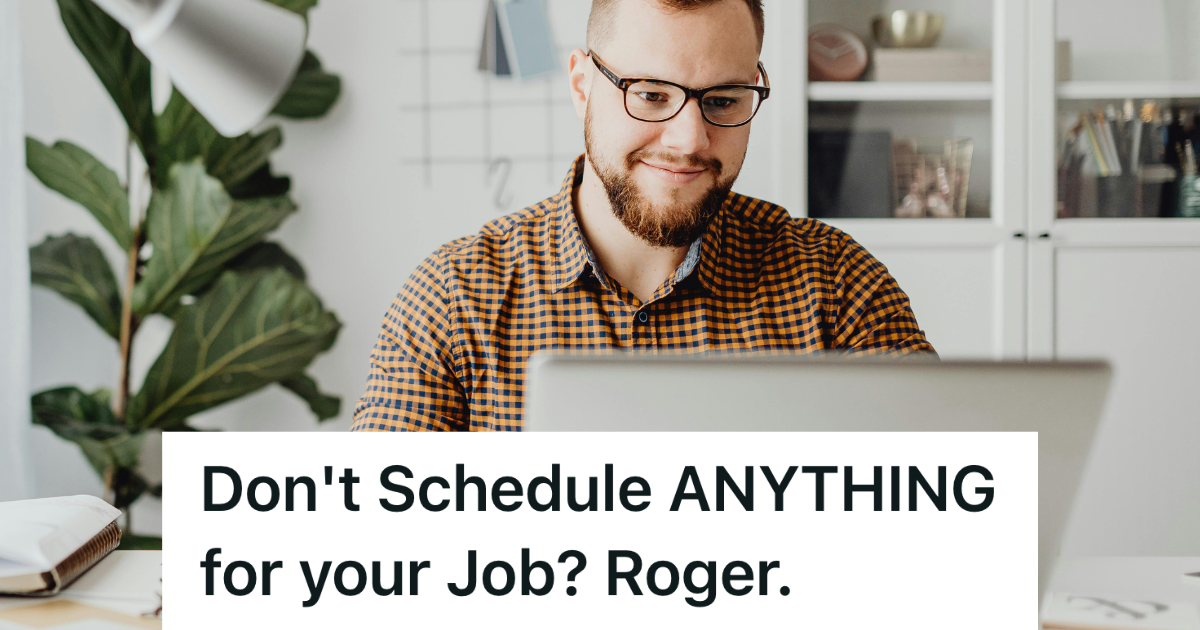 man in plaid shirt sitting at computer