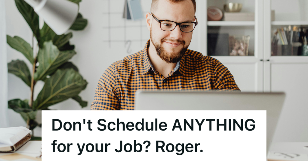 man in plaid shirt sitting at computer