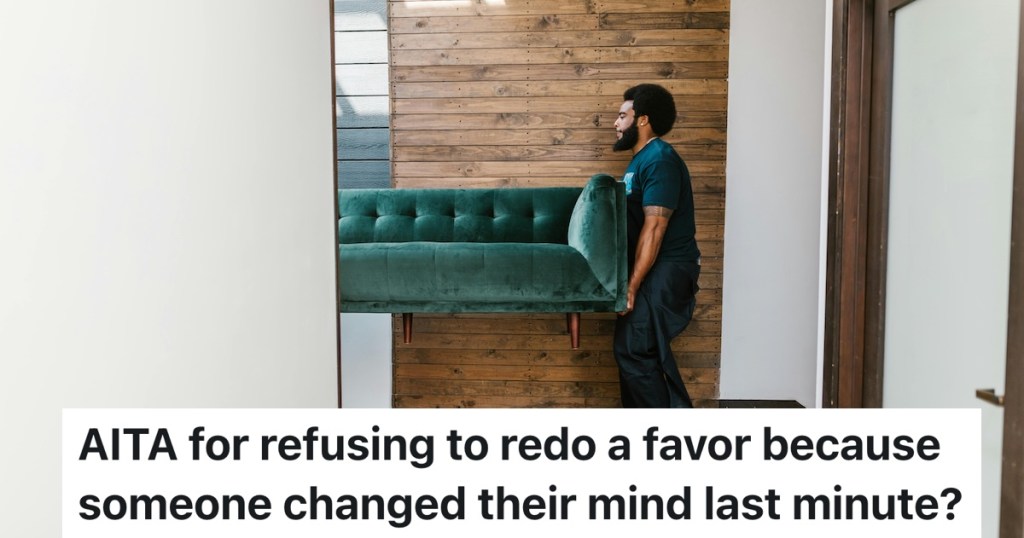 person moving a couch into an apartment