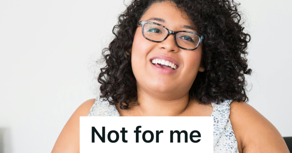 smiling woman with glasses and curly hair