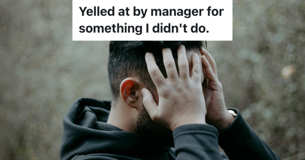 Man standing with hands on his face