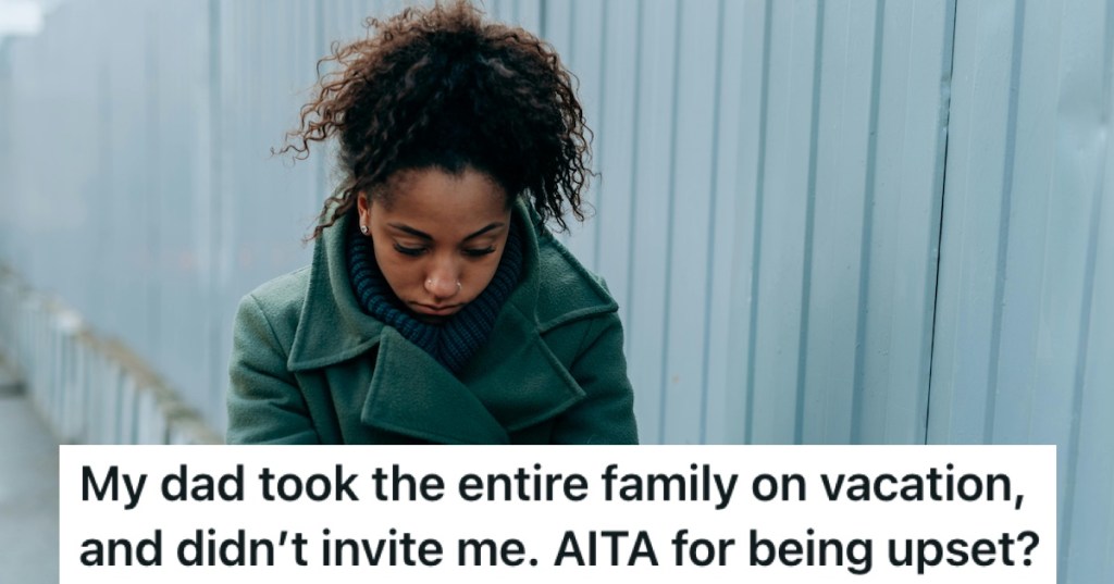 A young woman in a coat looking sad