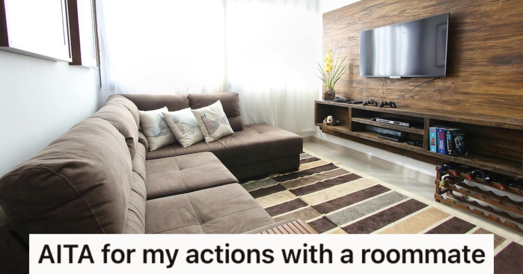 A living room with couch and large TV