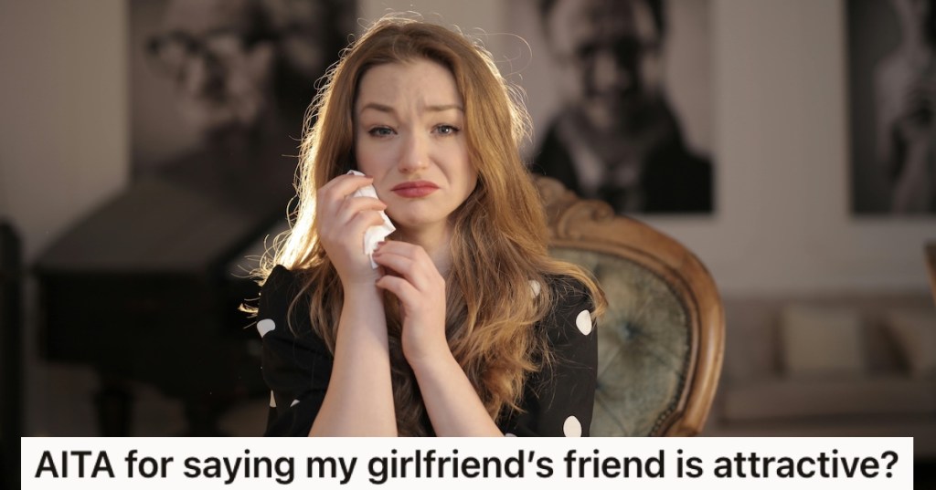 A crying woman holding a tissue