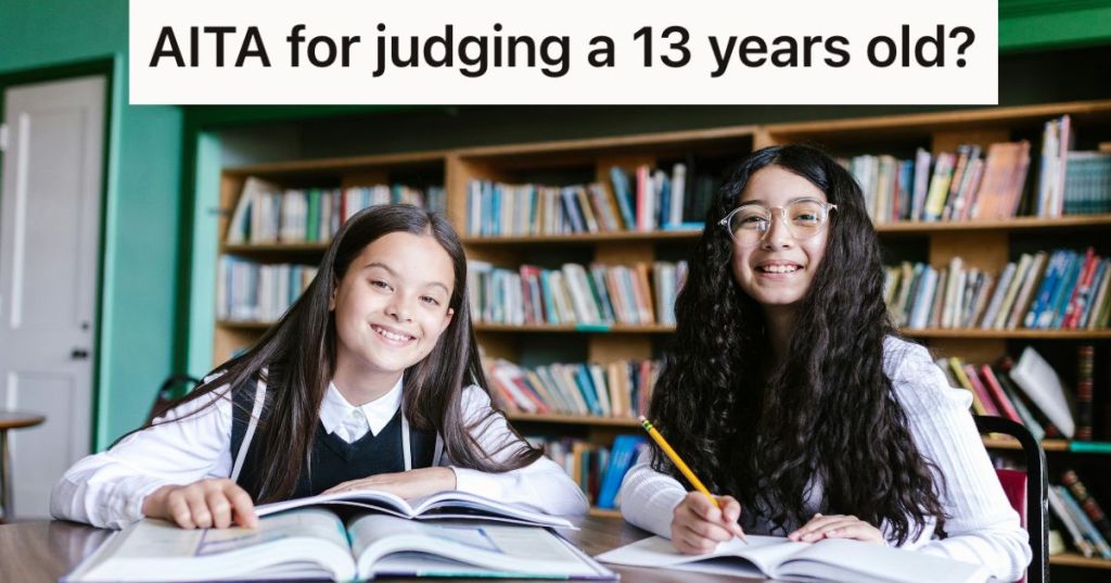 Two smiling young girls studying in a library