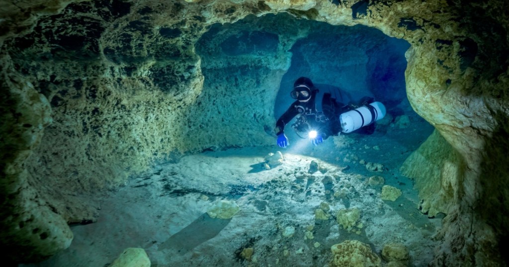 Diver in underwater cave