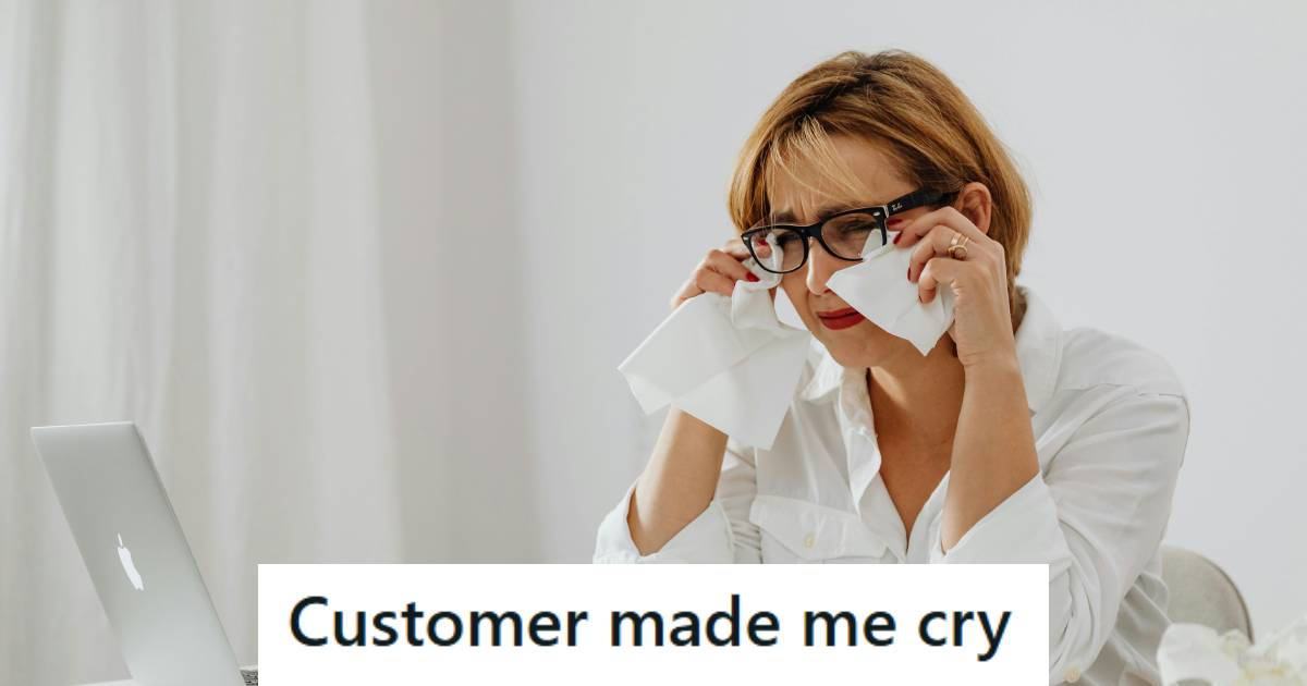 Woman crying at her desk over a story she heard