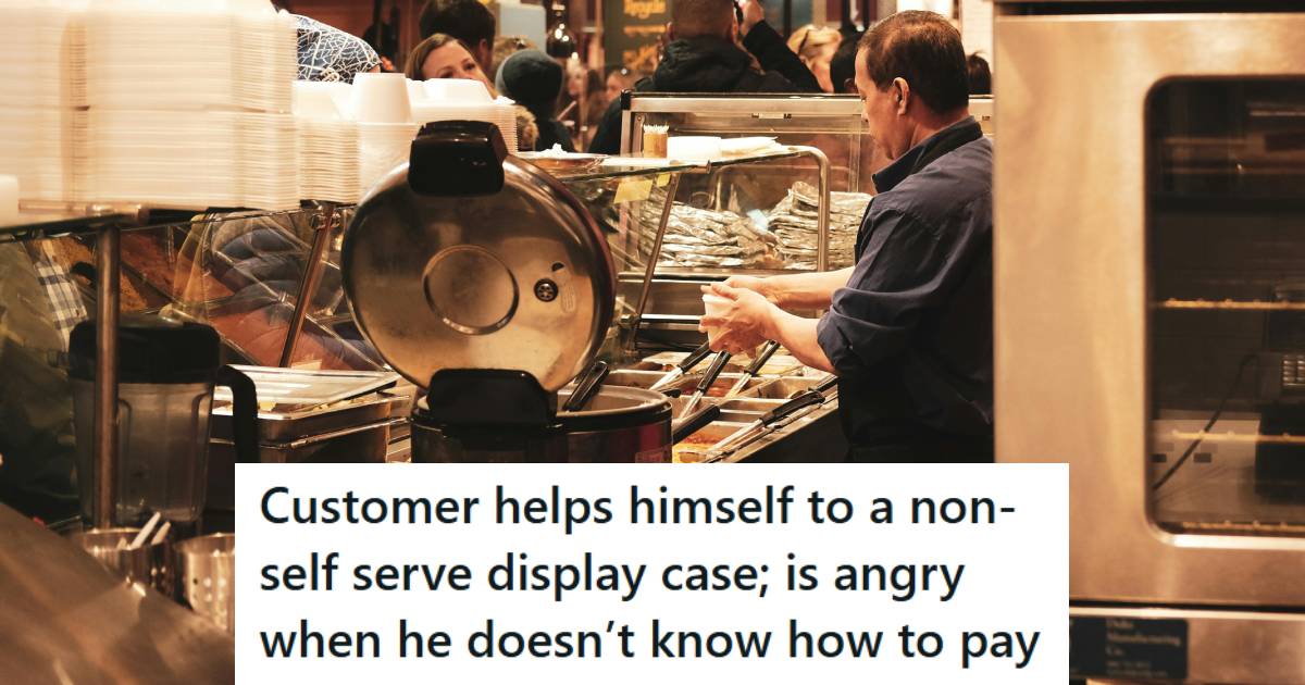 Man working behind a glass deli counter, helping customers