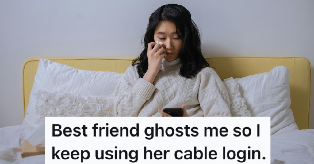 An upset woman looking at her phone