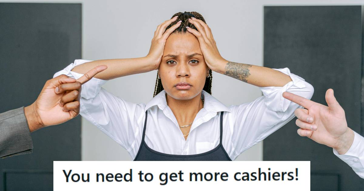 Cashier holding her head because they're busy and understaffed