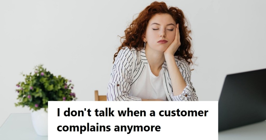 Tired woman sitting by desk