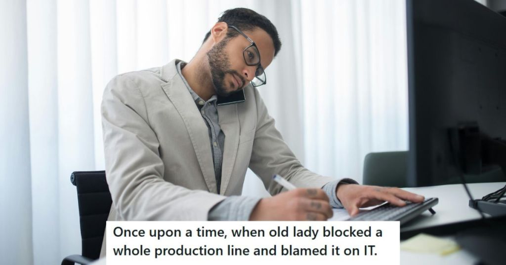 Man in grey jacket working on his computer