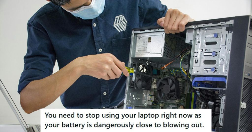 IT worker fixing a machine